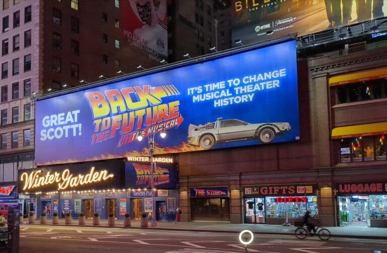 The Back to the Future franchise has expanded into various mediums since its original film trilogy, including a successful stage adaptation. Pictured is the marquee of Back to the Future: The Musical at Broadway's Winter Garden Theatre in August 2023. Credit: WikiMedia Commons CC BY-SA 4.0.
